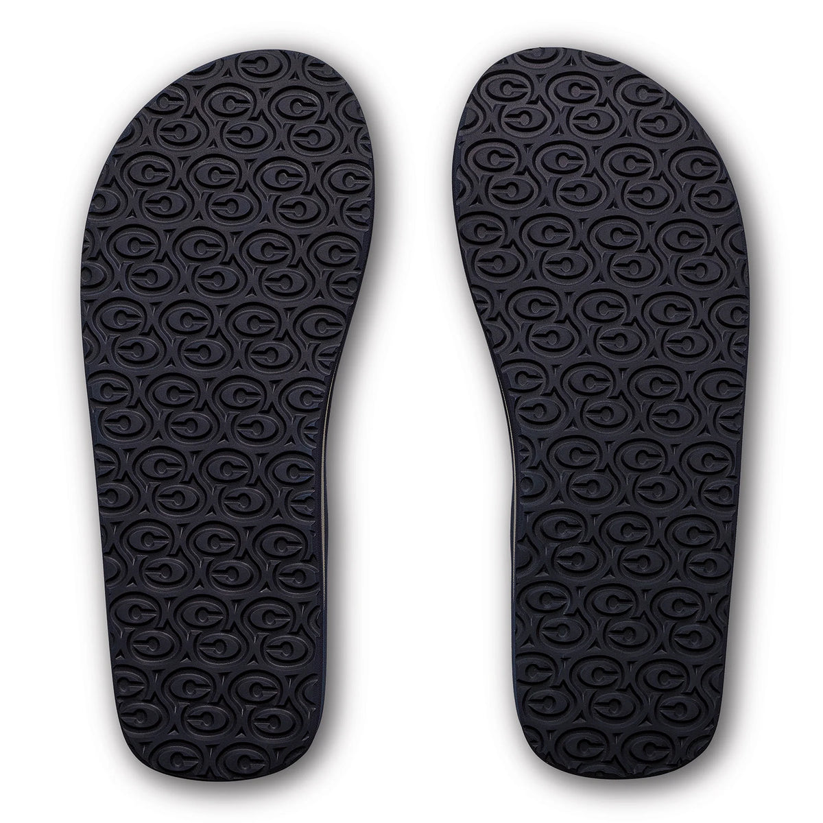 Cobian Salty Men's Flip Flops in Navy featuring textured rubber outsoles with a repeating Cobian logo traction pattern.
