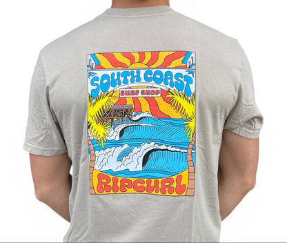 Person wearing a gray t-shirt with a colorful 'South Coast Rip Curl' graphic on the back.