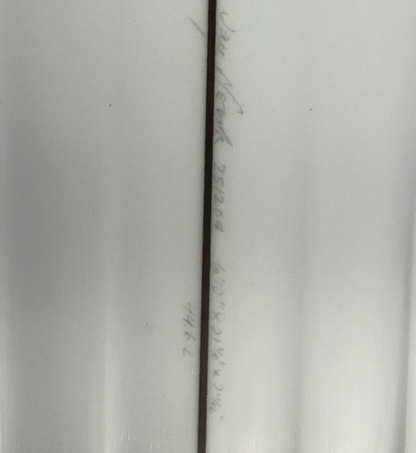 Dimensions of a AKA Twinzer on a white surfboard. 