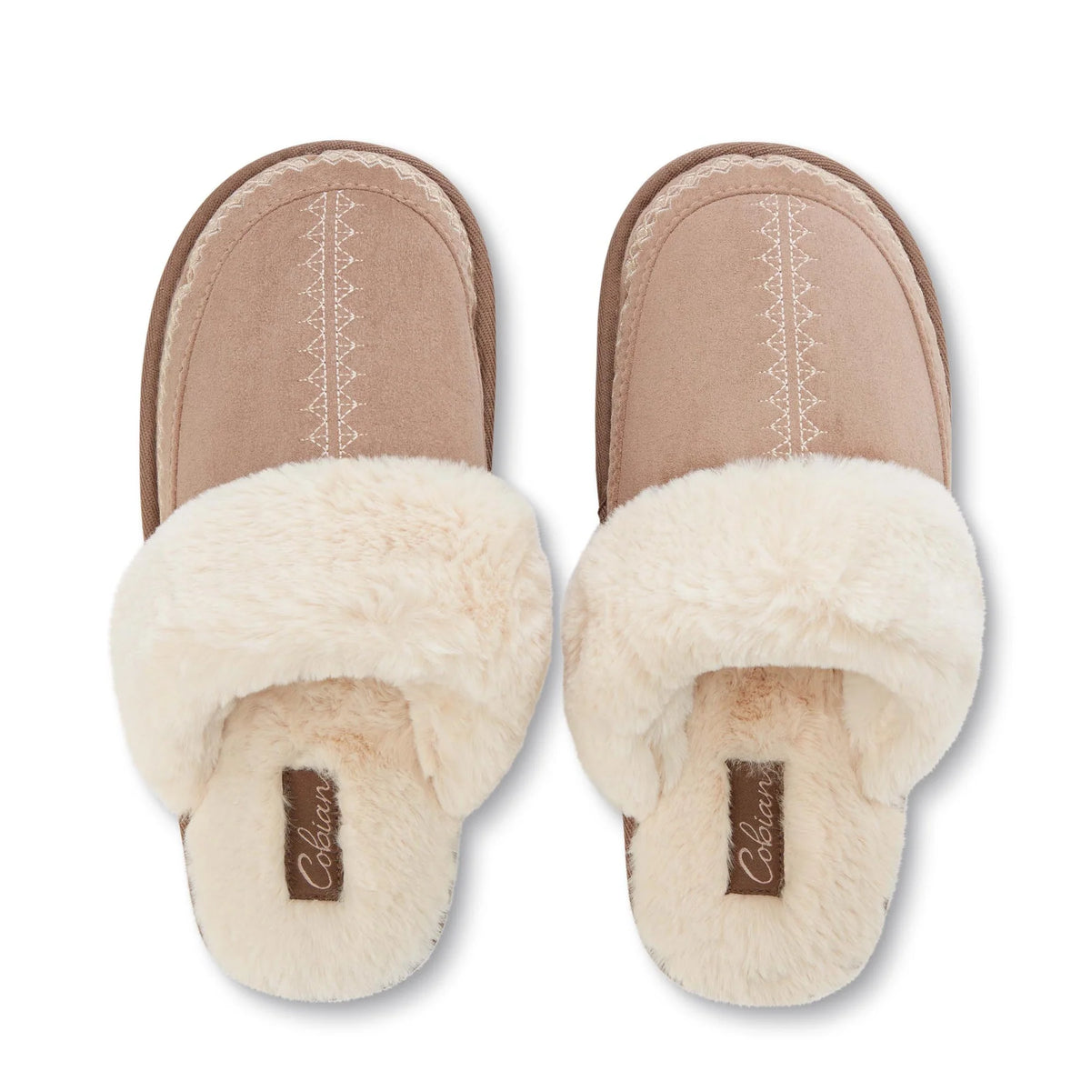Top view of Cobian Colima Mule slippers in Tan showing plush cream faux fur interiors, embroidered toe detailing, and Cobian branded footbeds.