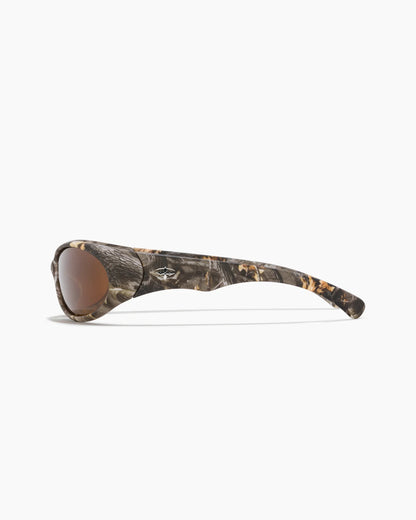 Demon Speed Camo Sunglasses with brown lenses, wraparound frame, camouflage pattern, and logo detailing on the temple, shown from the side.