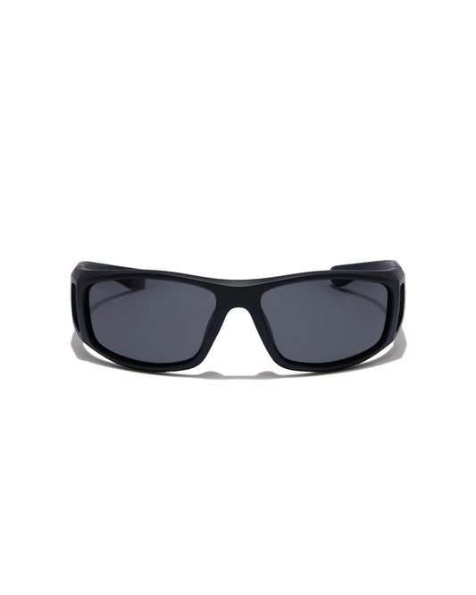 Dragster Matte Black Sunglasses with smoke tinted lenses, a thick black frame, and a sleek wraparound design, shown from a straight-on front angle.