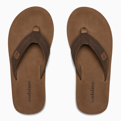 Top-down view of Cobian Dunes Brown flip flops showing tan footbeds with Cobian branding, dark brown stitched straps, and woven toe posts.