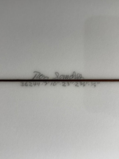 Signature and Dimensions on bottom of white surfboard. 