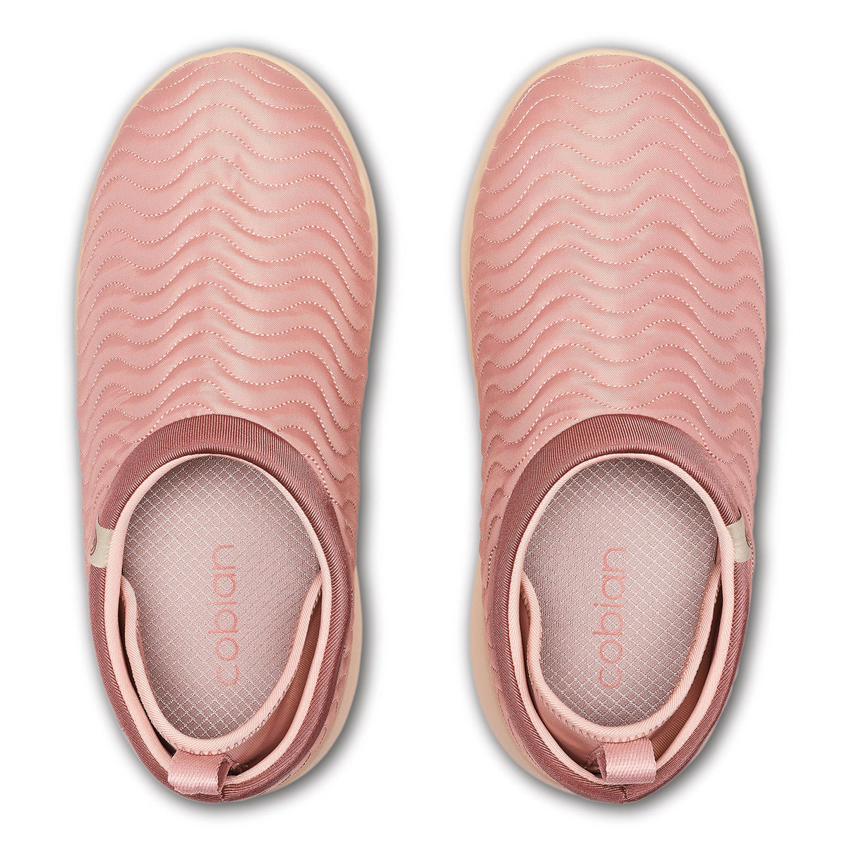 Top view of Cobian FlipSlip Mauve shoes showing quilted wave-pattern uppers, cushioned footbeds, and easy slip-on openings.