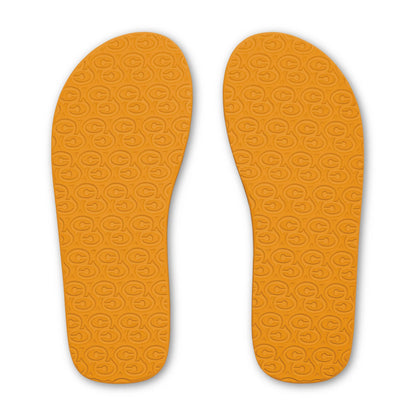 Cobian Foamie Brown Flip Flops bottom view featuring bright orange rubber outsoles with repeating Cobian logo traction pattern