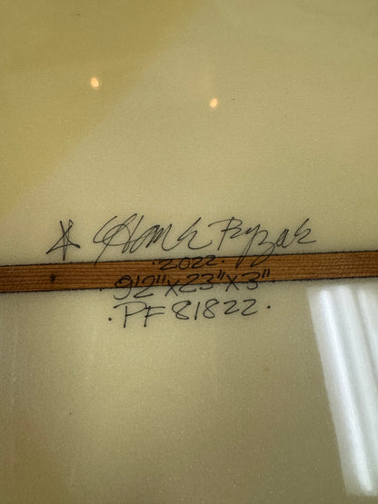 A close up shot of a Hank Byzak board with the dimensions written by hand. 