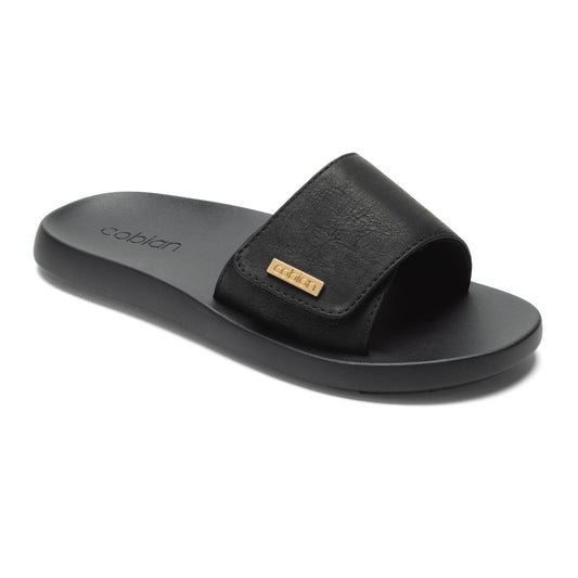 Cobian Ibiza Slide Sandal in Black featuring a wide adjustable strap with gold Cobian logo and cushioned footbed.