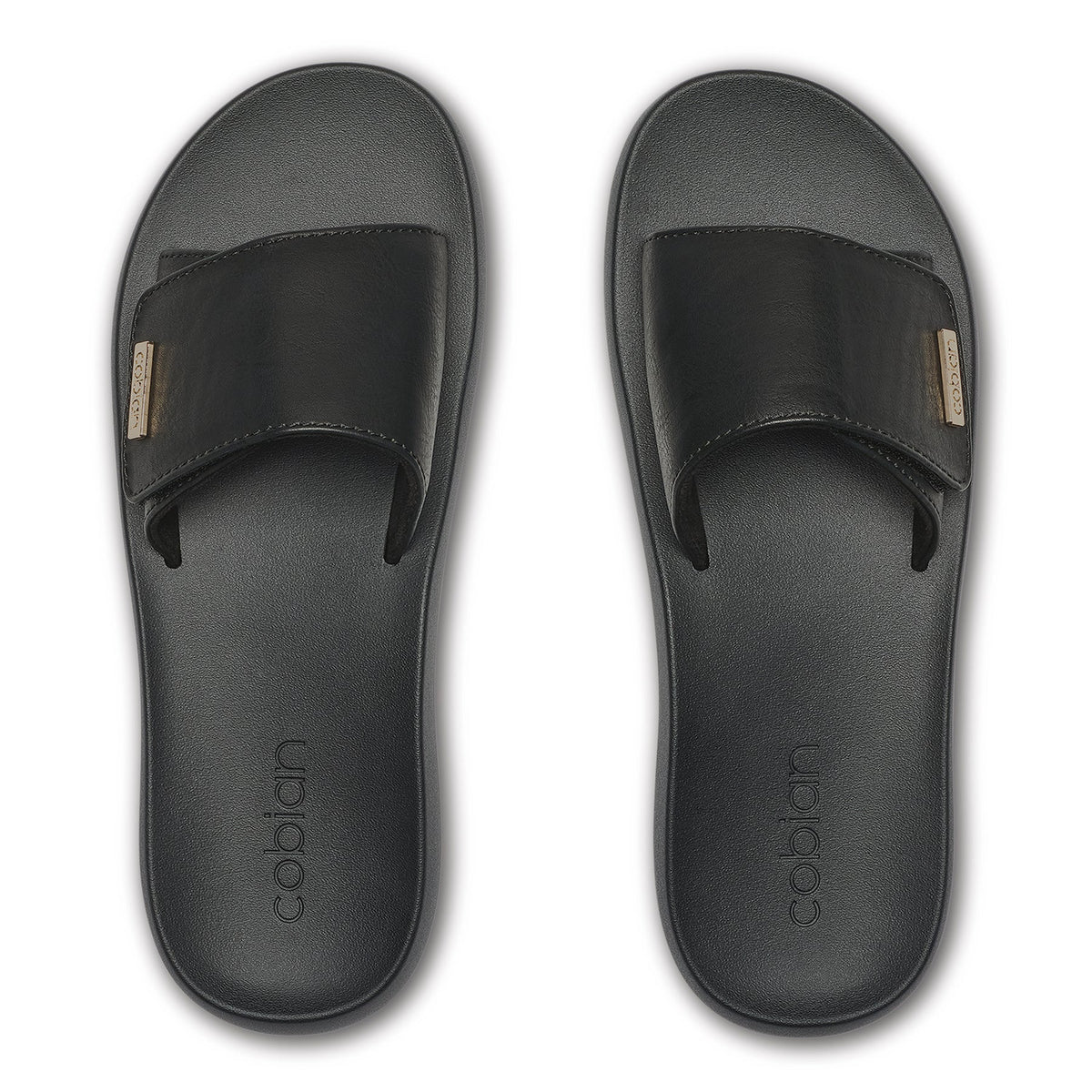 Top view of Cobian Ibiza Slide Sandals in Black highlighting the adjustable wide straps, textured footbeds, and gold logo details.