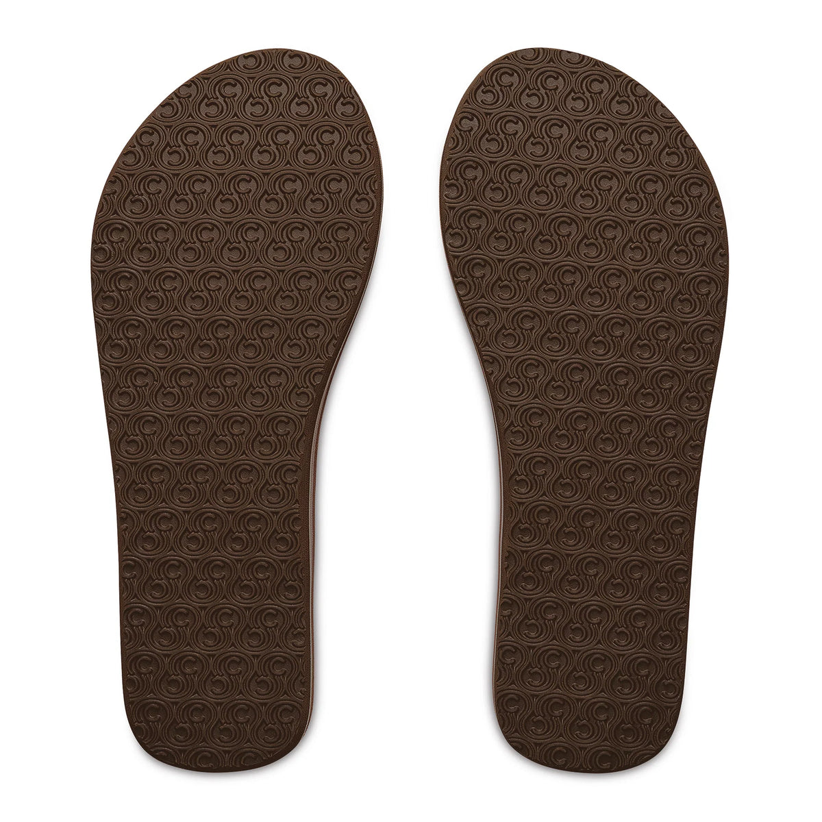 Bottom view of Cobian Kaia Flip Flops in Cream showing brown rubber outsoles with an allover textured traction pattern.