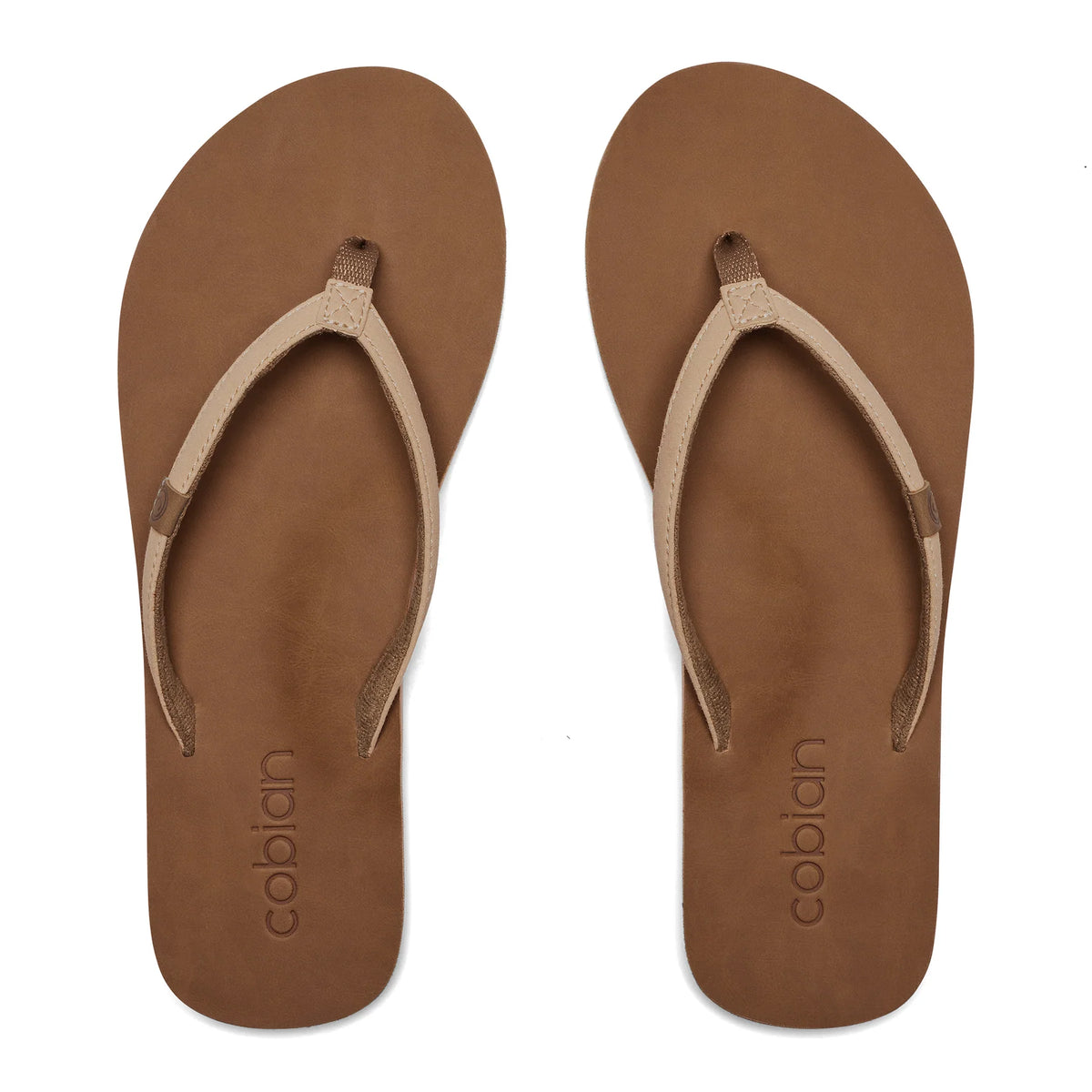 Top view of Cobian Kaia Flip Flops in Cream showing slim V-shaped straps, brown footbeds, and embossed Cobian branding at the heels.