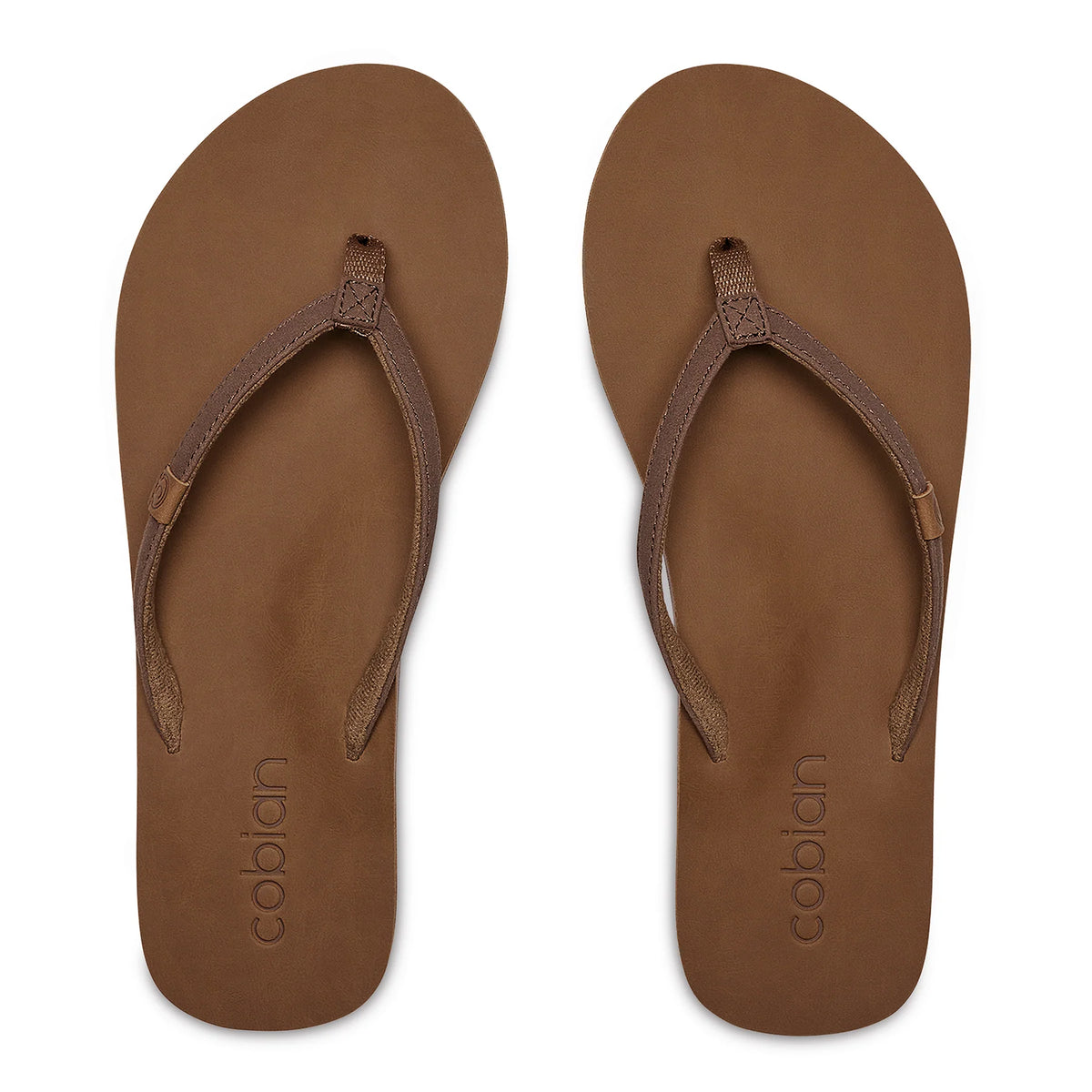 Top view of Cobian Kaia Flip Flops in Mocha showing slim V-shaped brown straps, cushioned footbeds, and embossed Cobian branding at the heels.