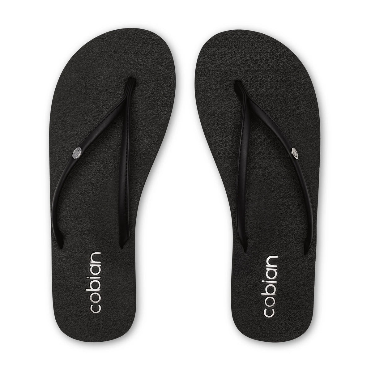 Top view of Cobian Nias Bounce 2 black flip flops featuring textured footbeds, slim black thong straps, and white Cobian heel branding.