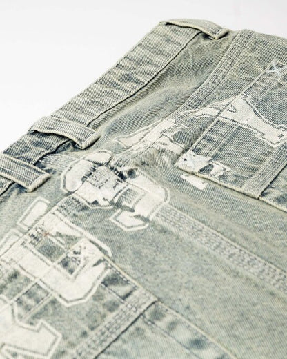 Close-up of Rusty Norty Low Rise Mini Skirt washed denim and back graphic details