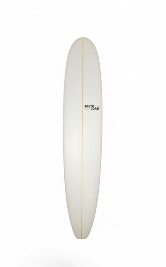 A long, narrow white surfboard floating vertically against a plain white background, with a small black logo near the center. 