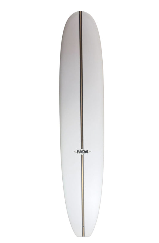 Front of a white 9'0 surfboard with a thick wood stringer. 