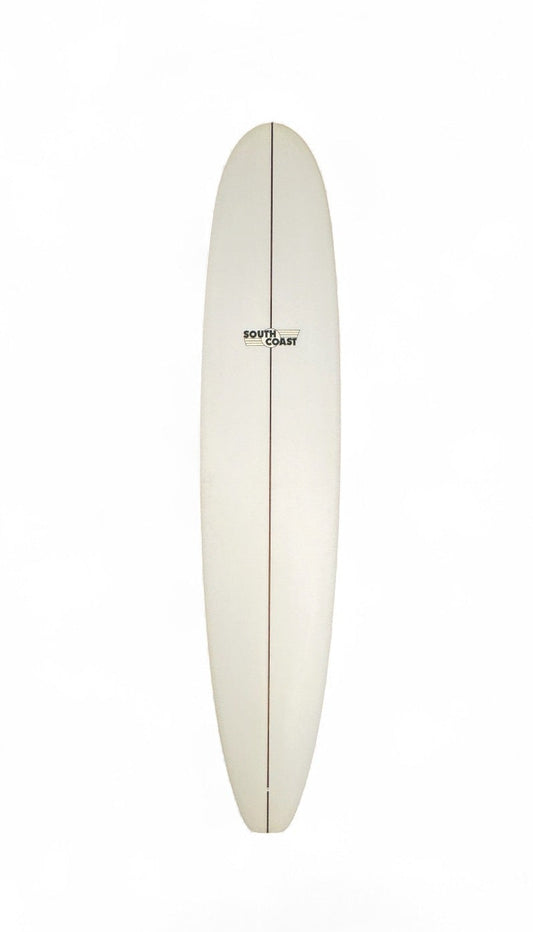The front of a white South Coast longboard. With a South Coast logo toward the top of the board. 
