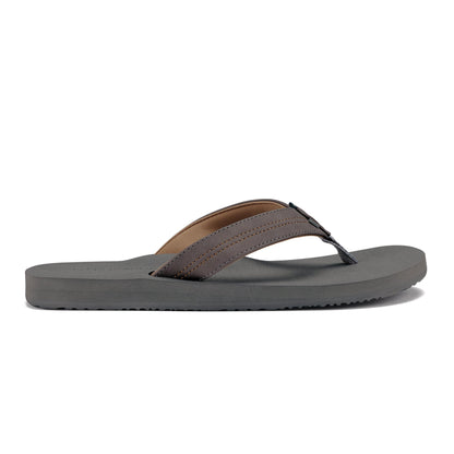Side profile of Cobian Salty Flip Flops in Charcoal showing the low-profile gray sole, padded straps, and textured footbed.