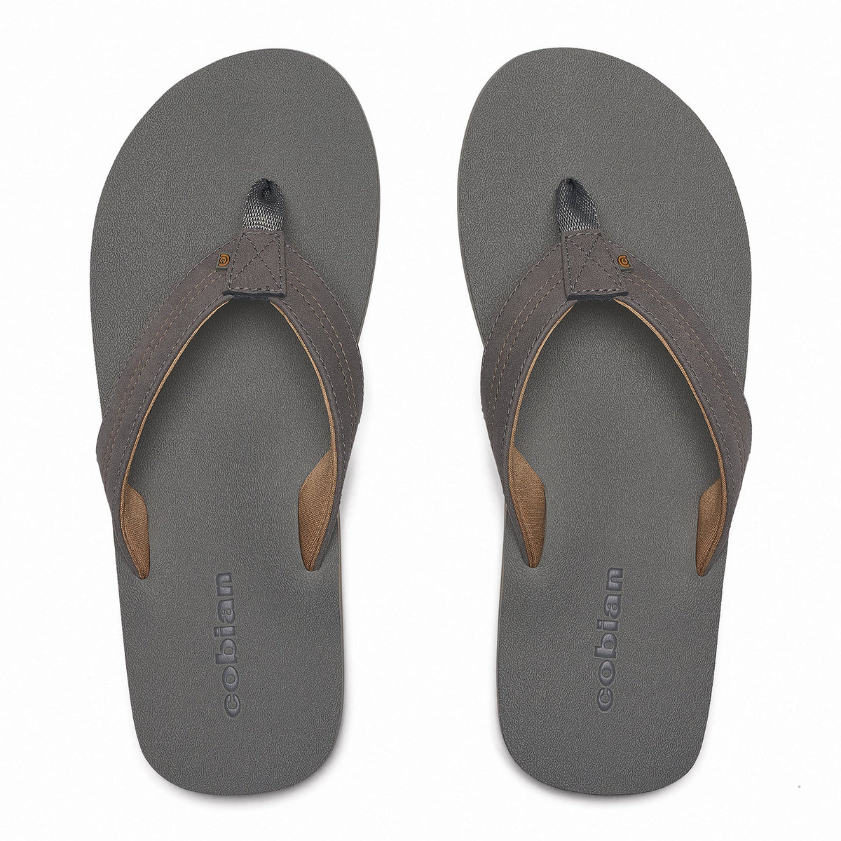 Top view of Cobian Salty Flip Flops in Charcoal showing textured gray footbeds, padded thong straps, tan lining, and Cobian branding.