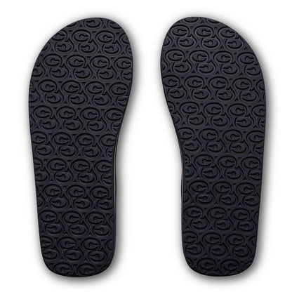 Cobian Salty Men's Flip Flops in Navy featuring textured rubber outsoles with a repeating Cobian logo traction pattern.