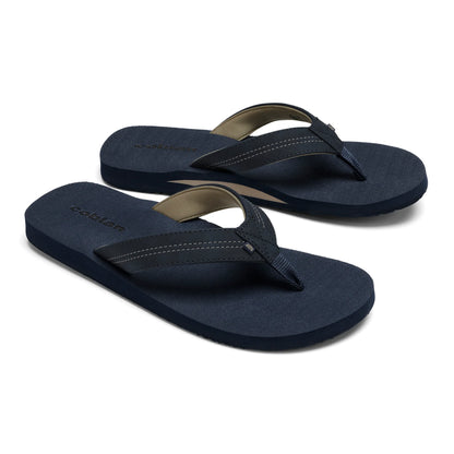 Pair of Cobian Salty Men's Flip Flops in Navy showing cushioned footbeds, navy stitched straps, tan lining, and Cobian branding.