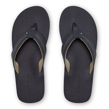 Top view of Cobian Salty Men's Flip Flops in Navy featuring textured footbeds, padded navy straps, tan interior lining, and embossed Cobian logos.