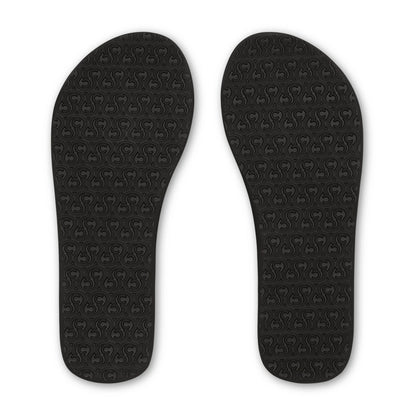 Cobian Skinny Bounce black flip flops featuring textured rubber outsoles with a repeating Cobian logo traction pattern.