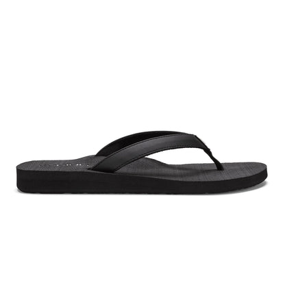 Side view of Cobian Skinny Bounce black flip flop showcasing a cushioned black sole, wide stitched straps, and a low-profile design.