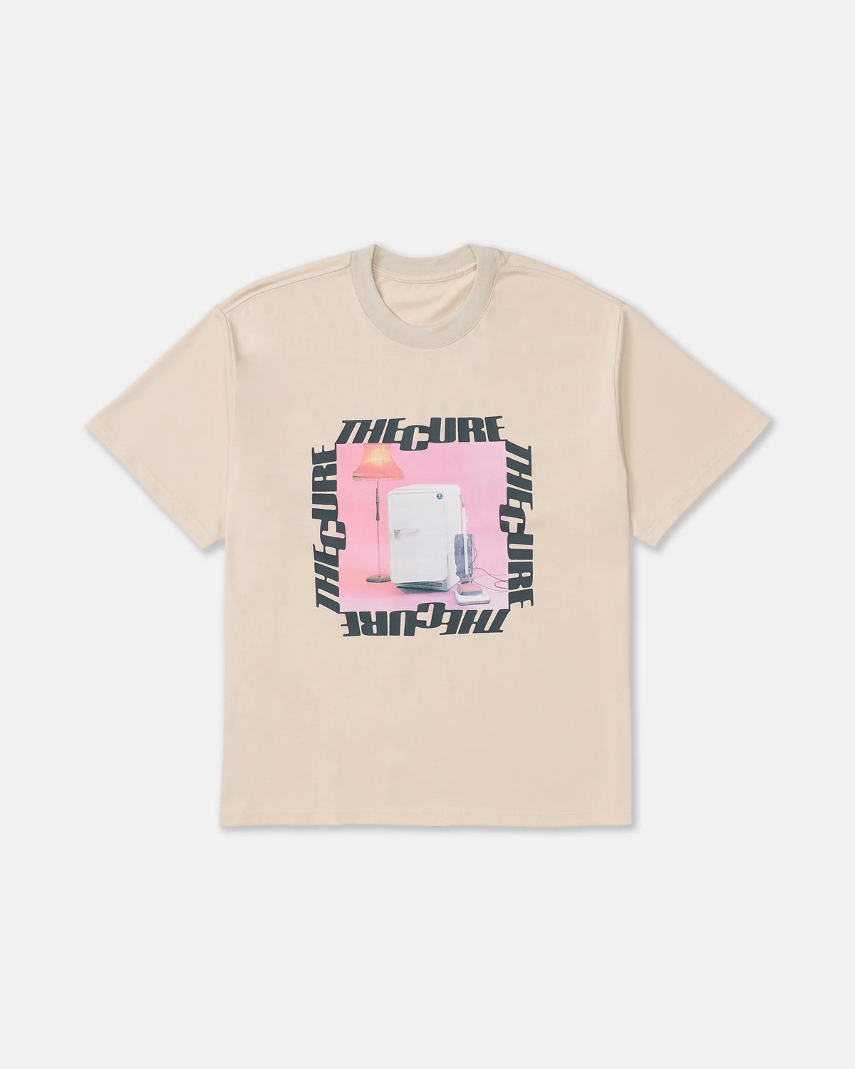 RVCA x The Cure Tee in cream featuring a pink vintage-inspired refrigerator and lamp graphic surrounded by bold black The Cure lettering.
