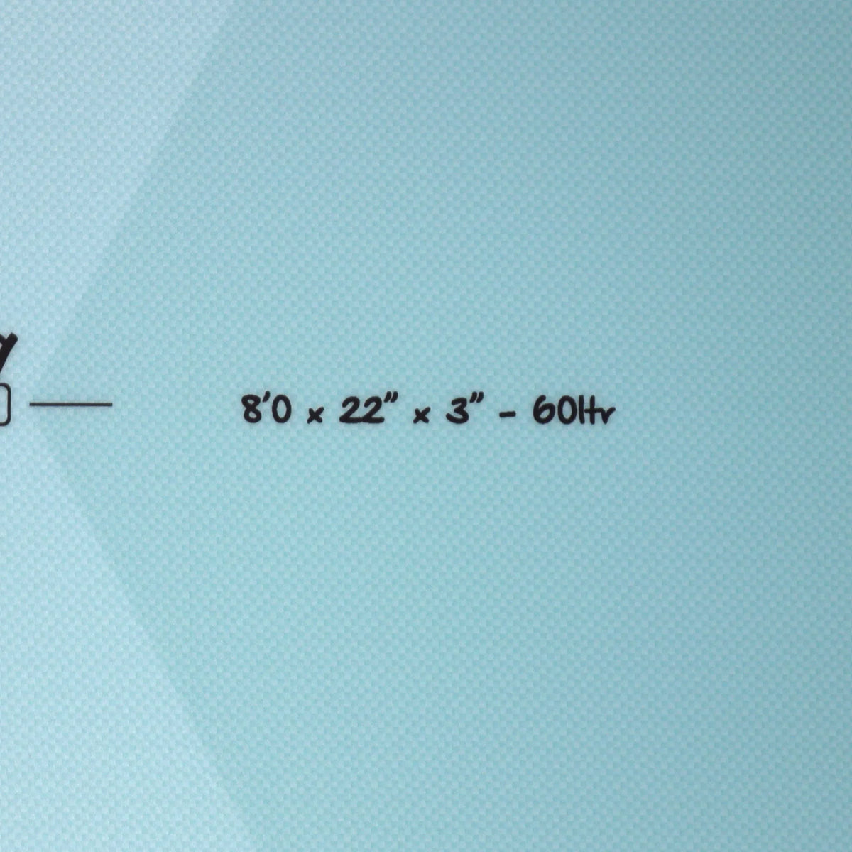 A close-up of a light blue textured surface with printed black text reading “8”0 x 22” x 3” - 60Ltr”.