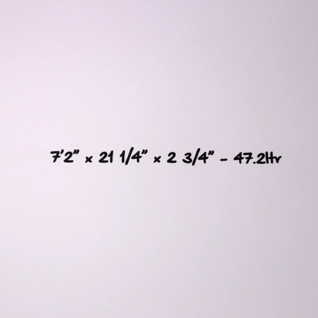 A white wall or background with black handwritten text reading “7'2” x 21 1/4” x 2 3/4” - 47.2 hr”.