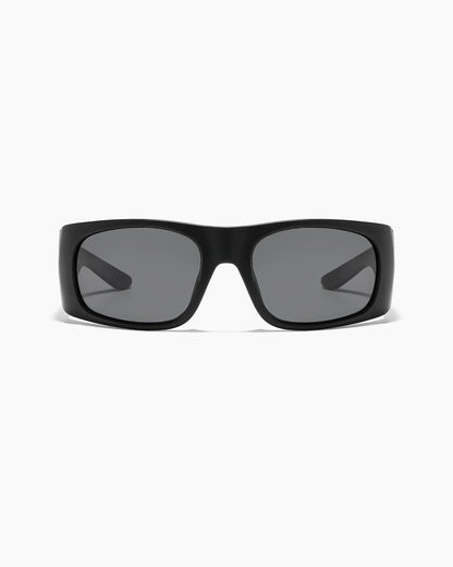 Transmitter by NOA Matte Black Sunglasses featuring smoke gray lenses, a thick rectangular frame, and a bold wraparound design, shown from the front.