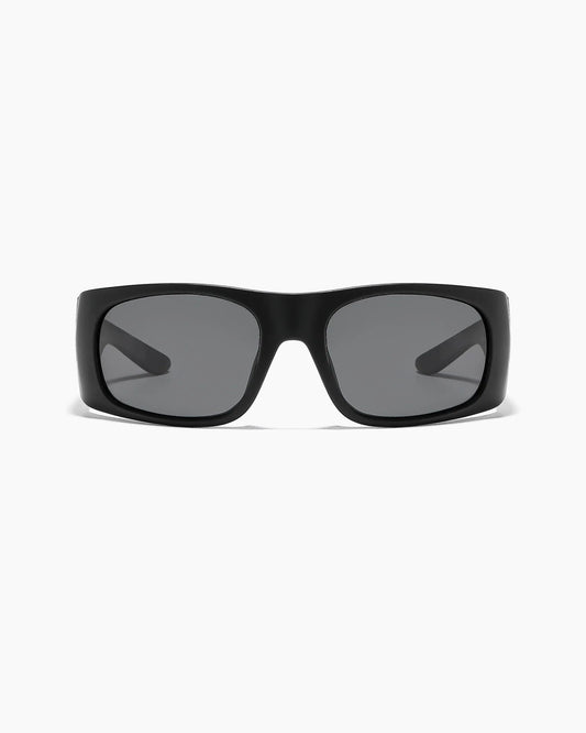 Transmitter by NOA Matte Black Sunglasses featuring smoke gray lenses, a thick rectangular frame, and a bold wraparound design, shown from the front.