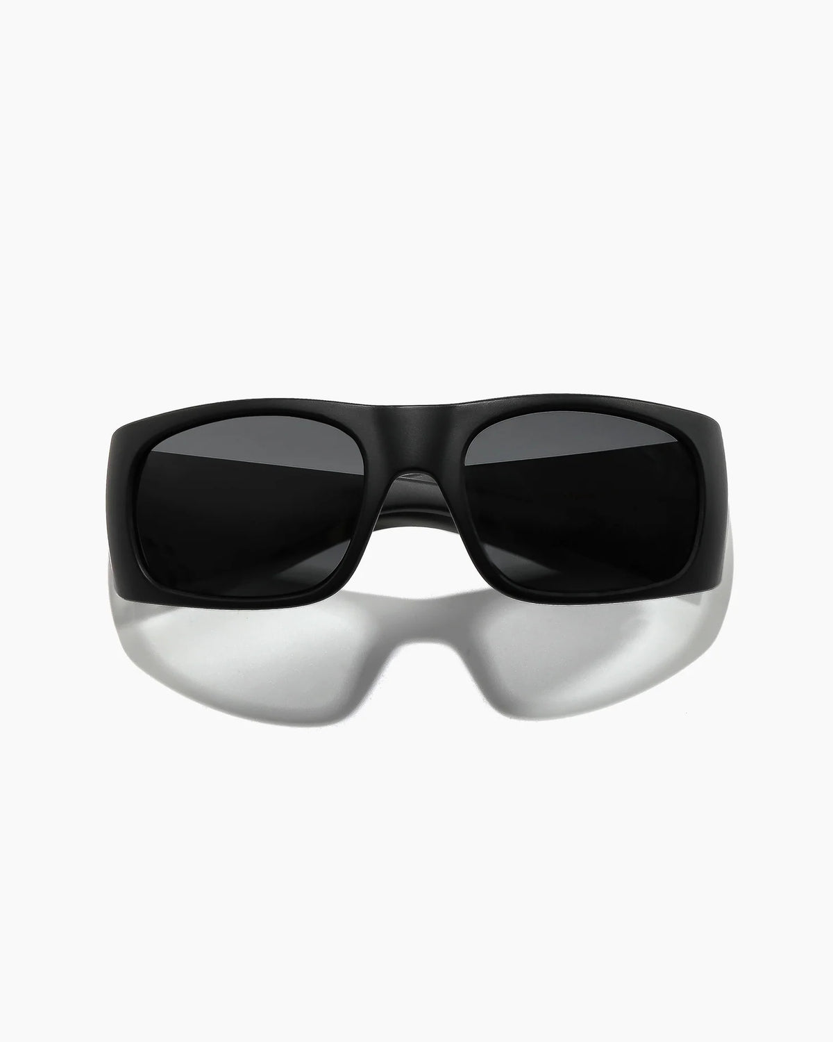 Transmitter by NOA Matte Black Sunglasses featuring dark smoke lenses, a thick rectangular frame, and a sleek wraparound silhouette, shown straight on.