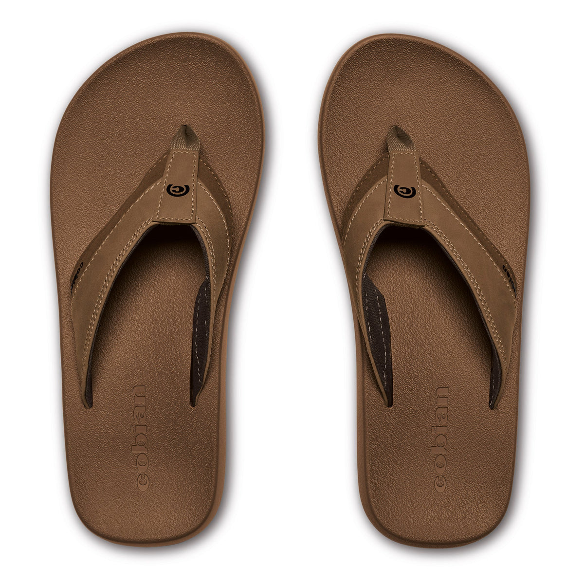 Top view of Cobian Venture Men's Flip Flops in Tan featuring textured brown footbeds, tan stitched thong straps, dark brown lining, and embossed Cobian logos.